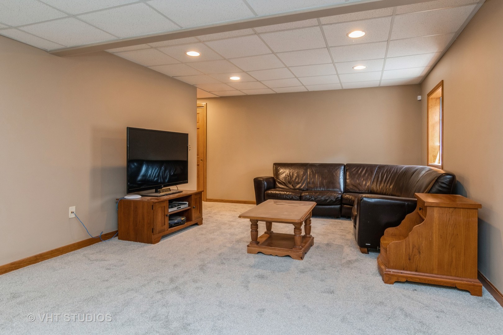 565 Boardman Circle Bolingbrook, IL 60440 - Photo 19 of 24 a living room with furniture and a flat screen tv