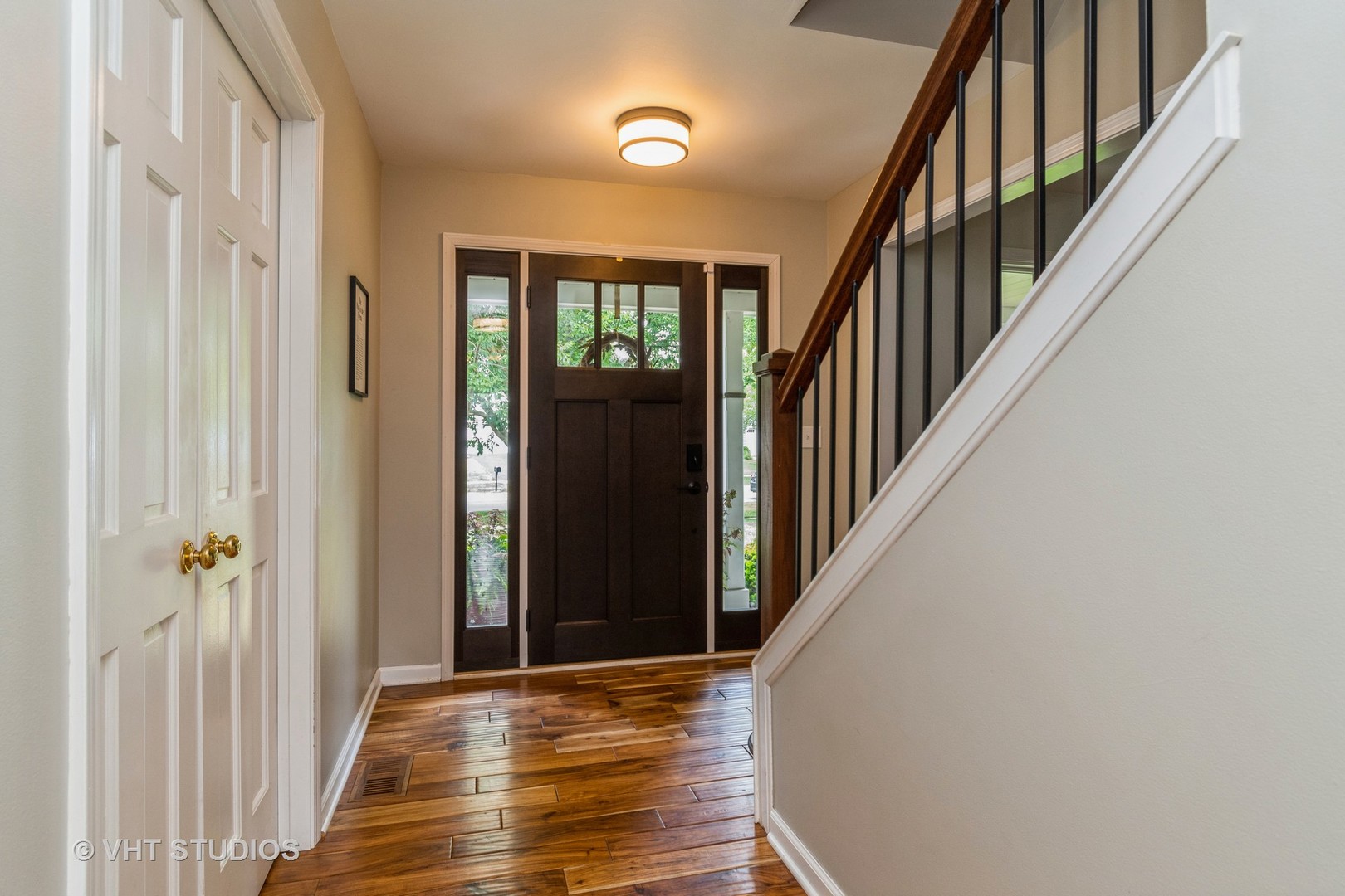 565 Boardman Circle Bolingbrook, IL 60440 - Photo 2 of 24 a view of a hallway with wooden floor and staircase
