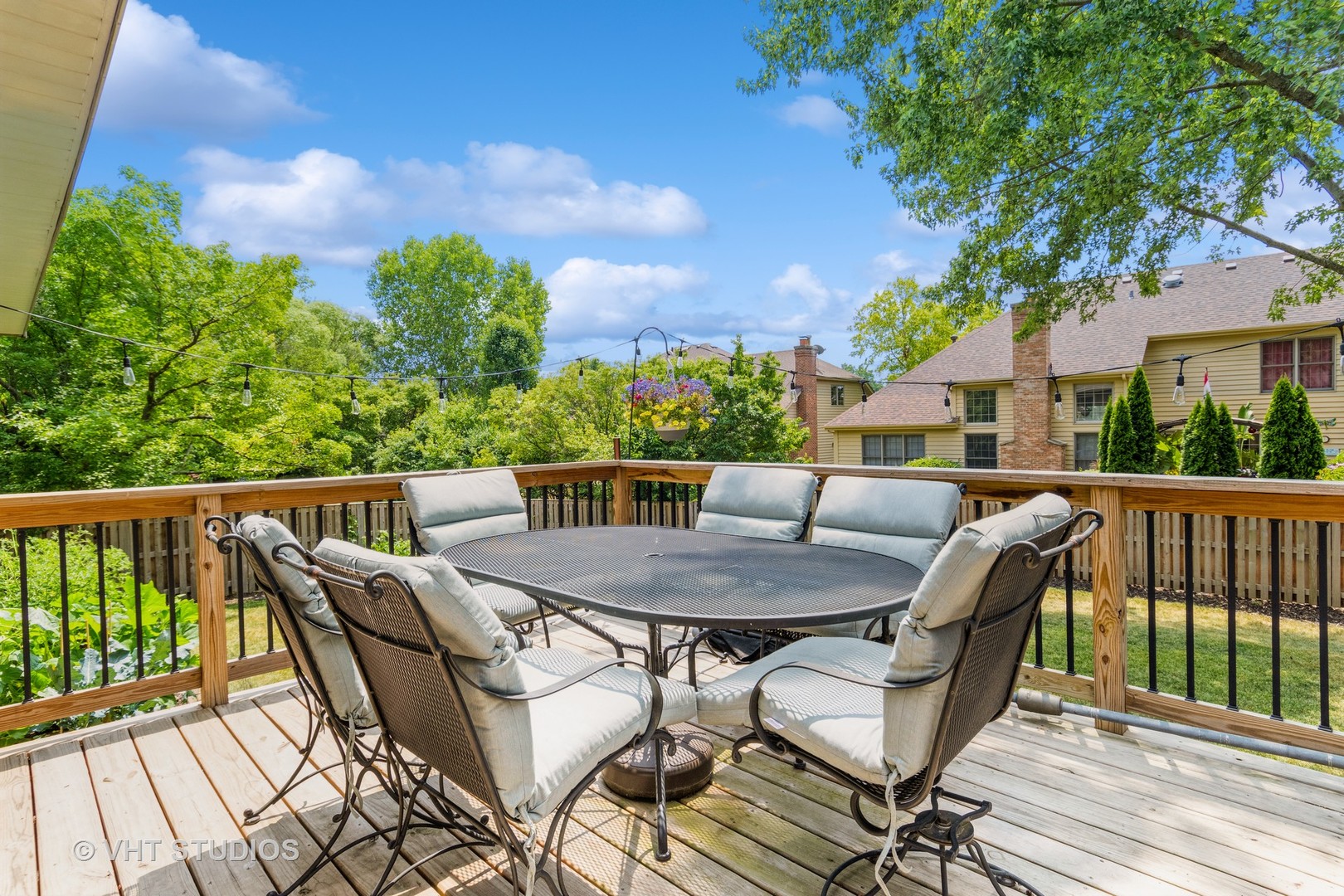 565 Boardman Circle Bolingbrook, IL 60440 - Photo 22 of 24 a balcony with wooden floor and outdoor seating