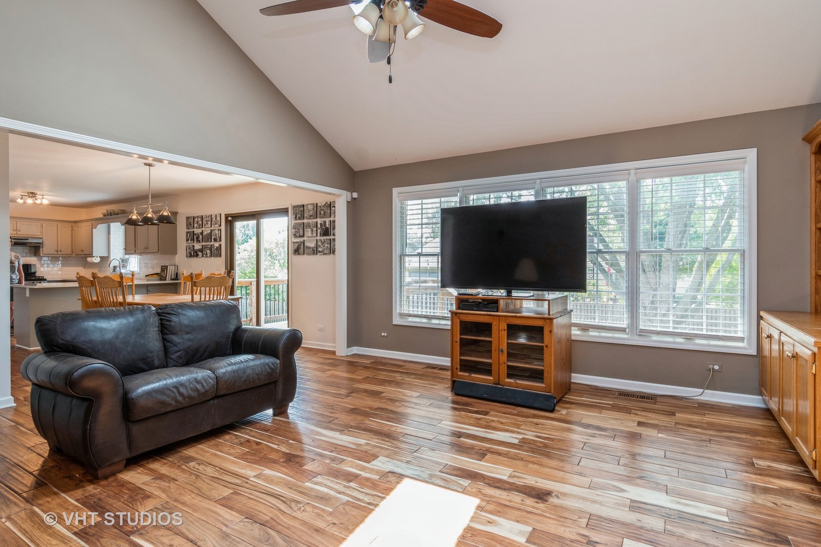 565 Boardman Circle Bolingbrook, IL 60440 - Photo 9 of 24 a living room with furniture and a flat screen tv