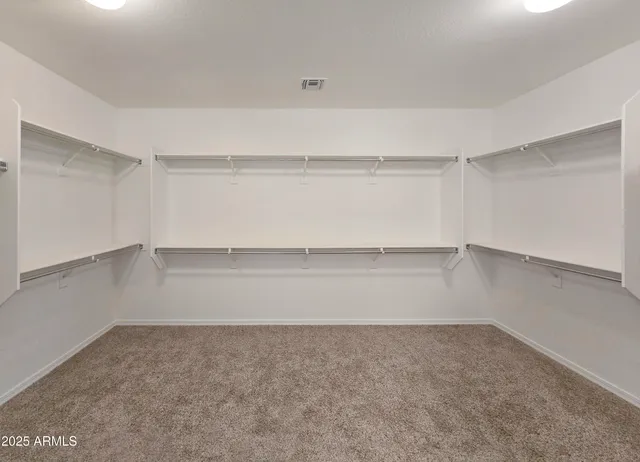 a view of an empty walk in closet