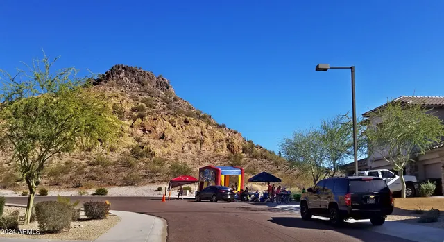 a view of street with parked cars