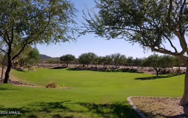 a view of a golf course with a lake view