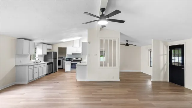 a view of kitchen with cabinets and stainless steel appliances