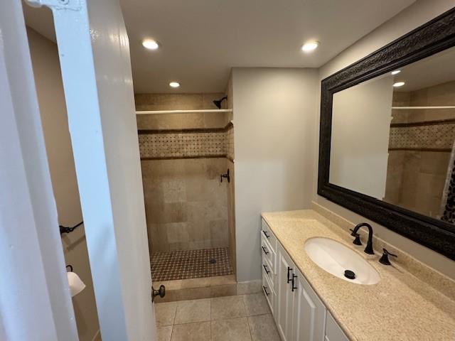 620 Northwest 13th Street, Unit 37 Boca Raton, FL 33486 - Photo 12 of 17 a bathroom with a double vanity sink a mirror and shower