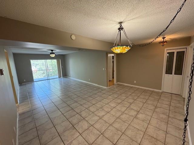 620 Northwest 13th Street, Unit 37 Boca Raton, FL 33486 - Photo 3 of 17 a hallway and a chandelier fan in a room