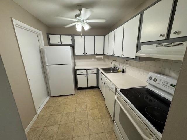 620 Northwest 13th Street, Unit 37 Boca Raton, FL 33486 - Photo 5 of 17 a kitchen with a stove a sink and a refrigerator
