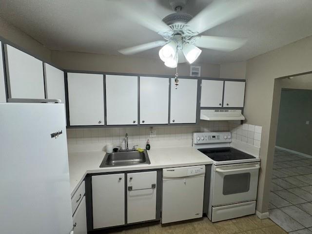 620 Northwest 13th Street, Unit 37 Boca Raton, FL 33486 - Photo 7 of 17 a kitchen with stainless steel appliances a sink stove and cabinets