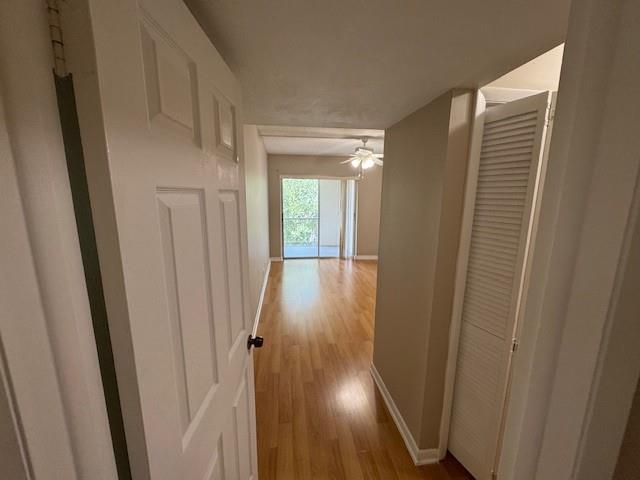 620 Northwest 13th Street, Unit 37 Boca Raton, FL 33486 - Photo 9 of 17 a view of a hallway with wooden floor