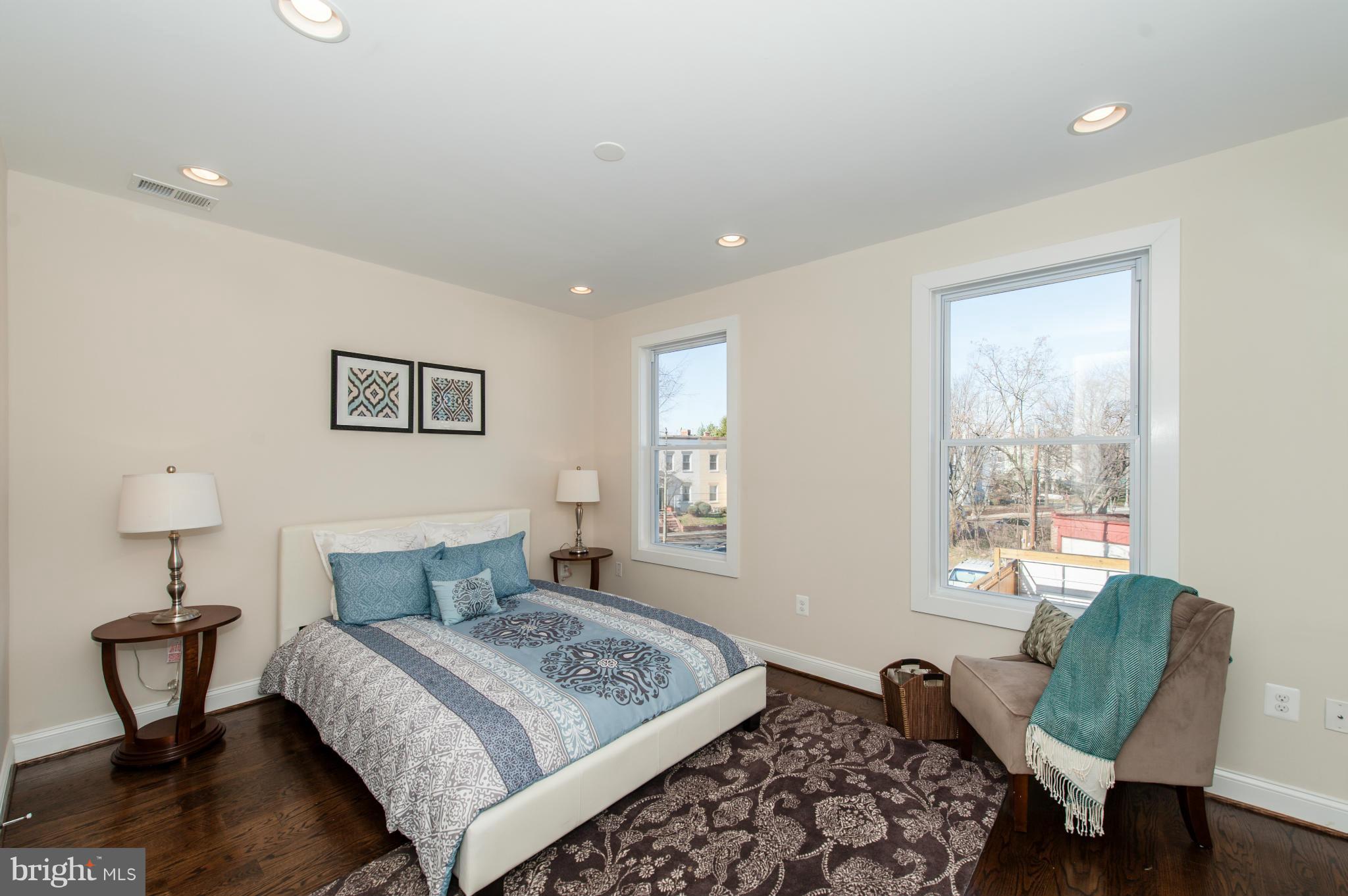 1608 Potomac Avenue Southeast Washington, DC 20003 - Photo 13 of 29 a bedroom with a bed a chair and a window
