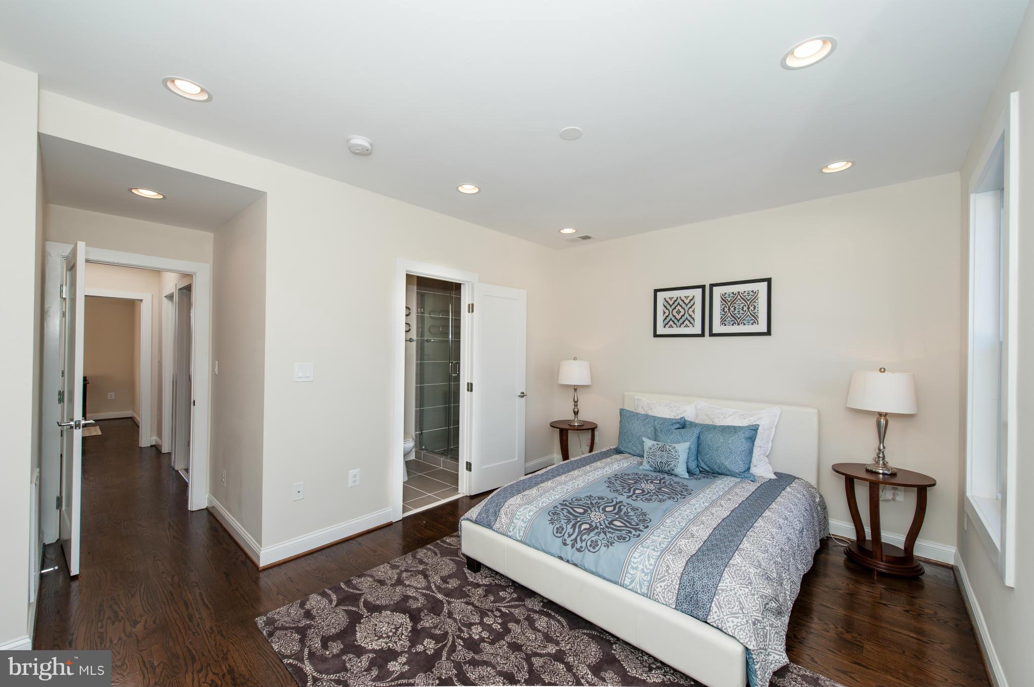 1608 Potomac Avenue Southeast Washington, DC 20003 - Photo 15 of 29 a bedroom with a bed and a table