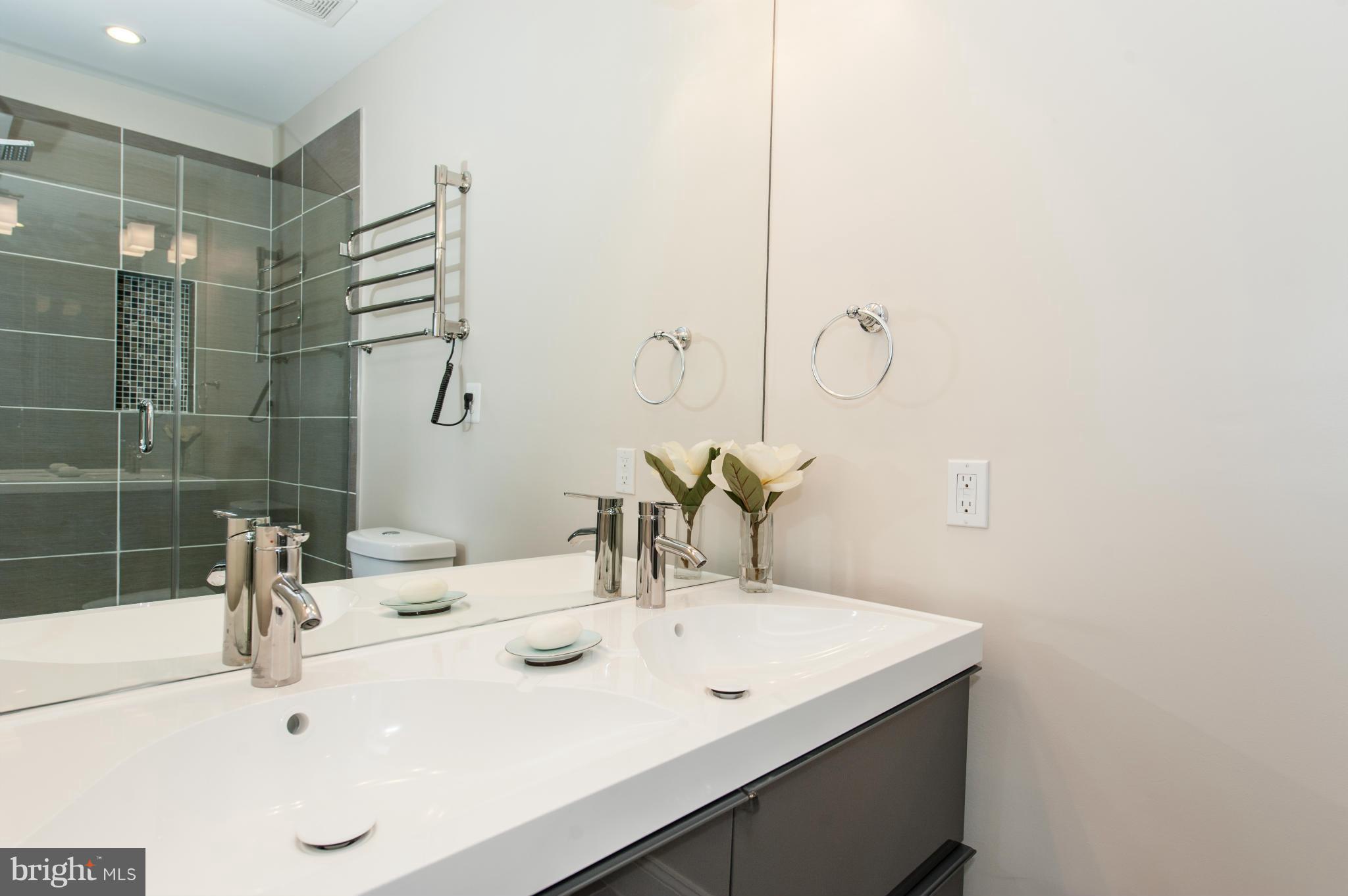 1608 Potomac Avenue Southeast Washington, DC 20003 - Photo 17 of 29 a bathroom with a sink and a mirror