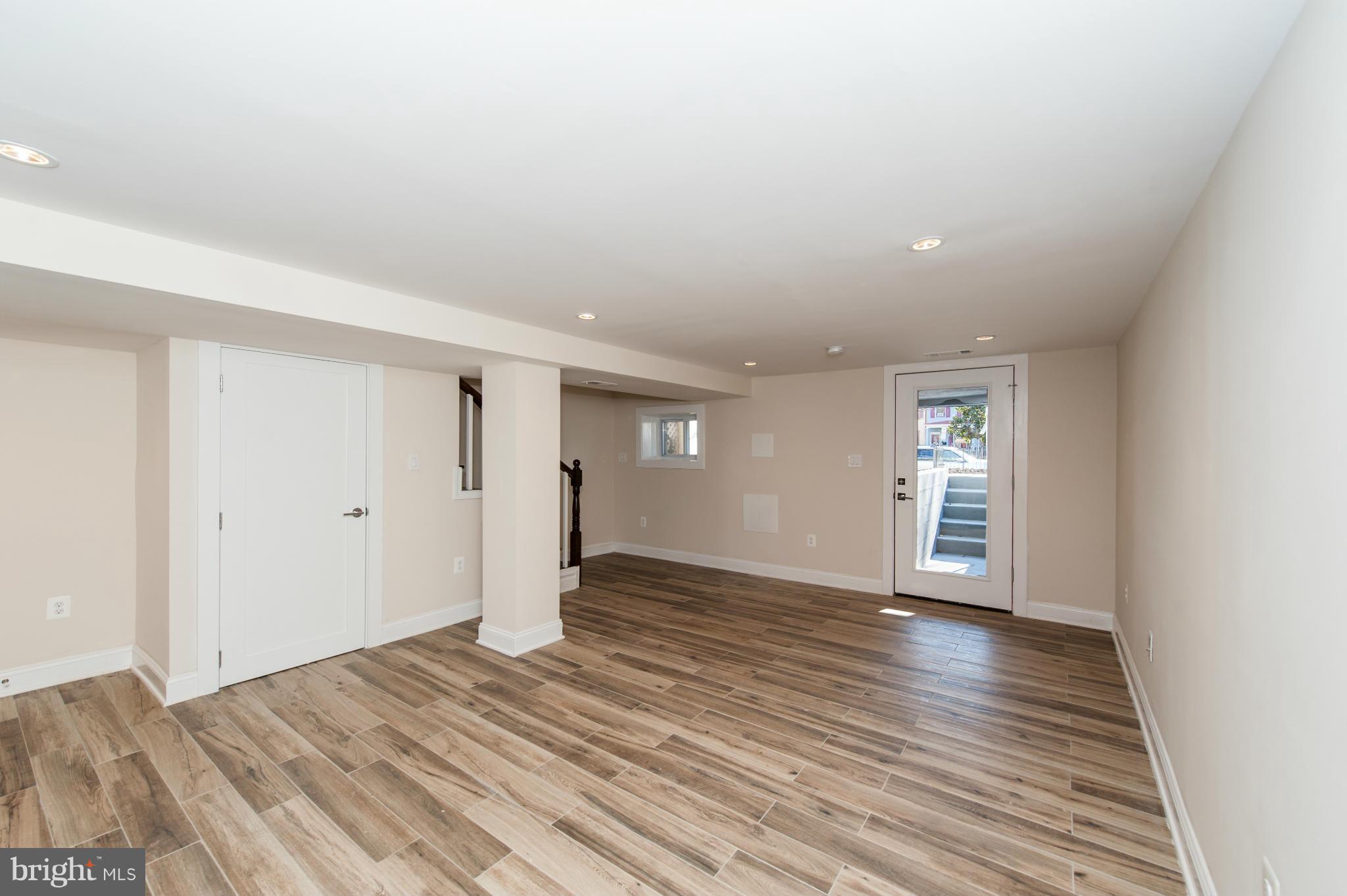 1608 Potomac Avenue Southeast Washington, DC 20003 - Photo 24 of 29 a view of an empty room with window and wooden floor