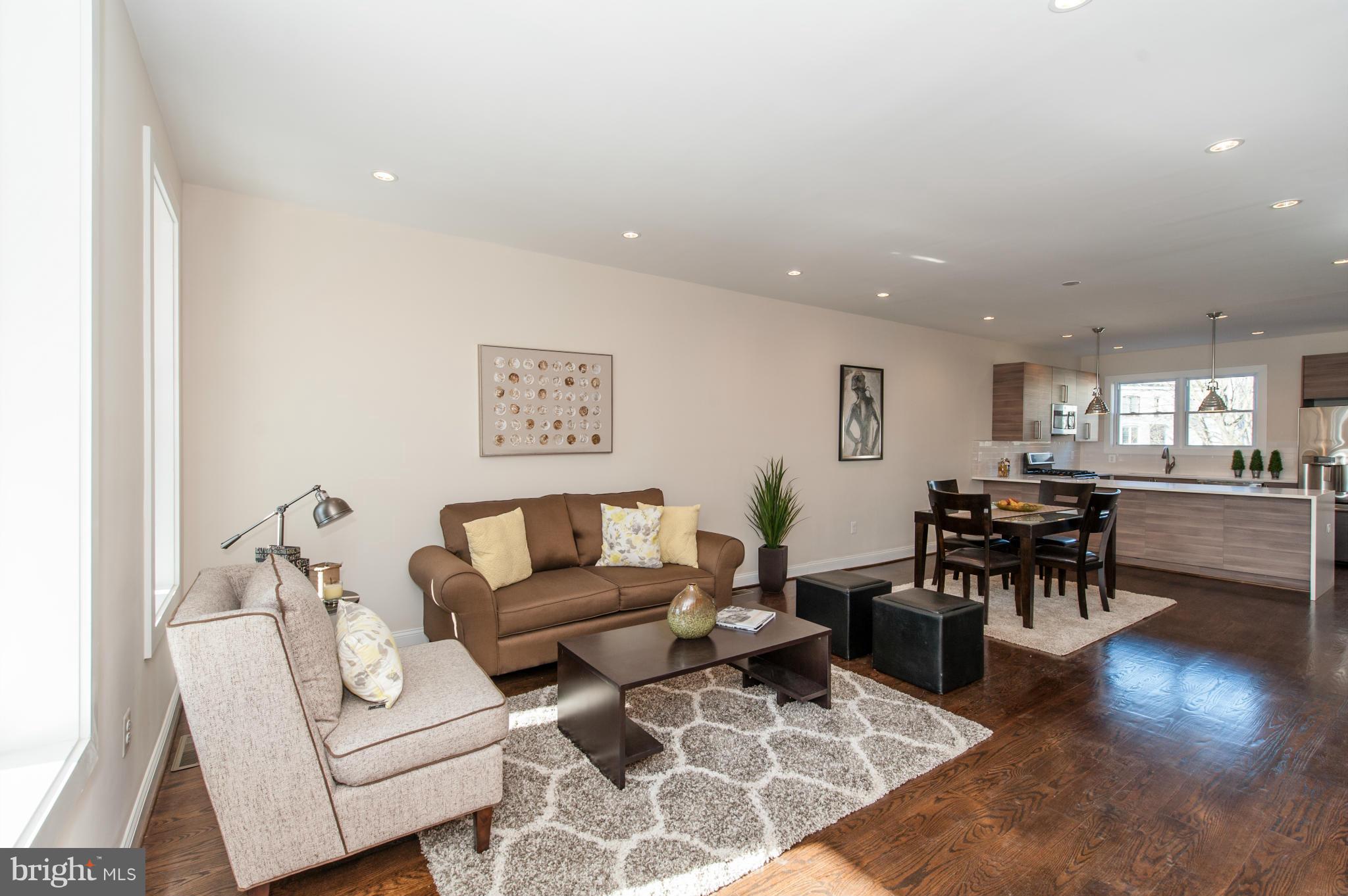 1608 Potomac Avenue Southeast Washington, DC 20003 - Photo 8 of 29 a living room with furniture and a view of kitchen