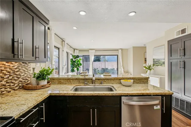 a kitchen with a sink and cabinets
