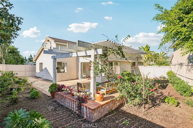 a front view of a house with a yard and outdoor seating