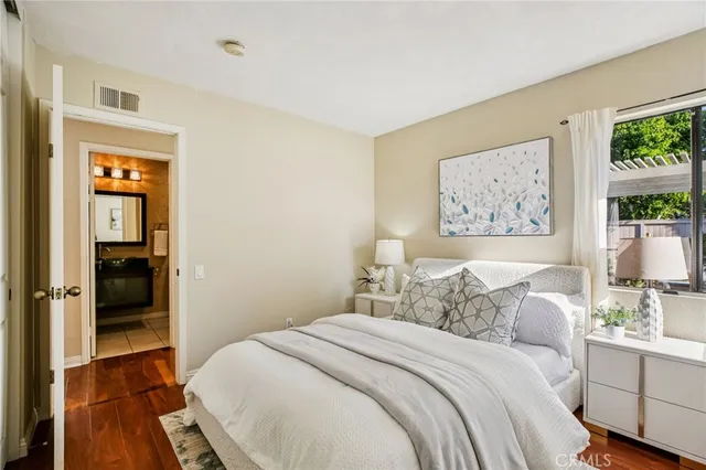 a bedroom with a bed and a view of bathroom