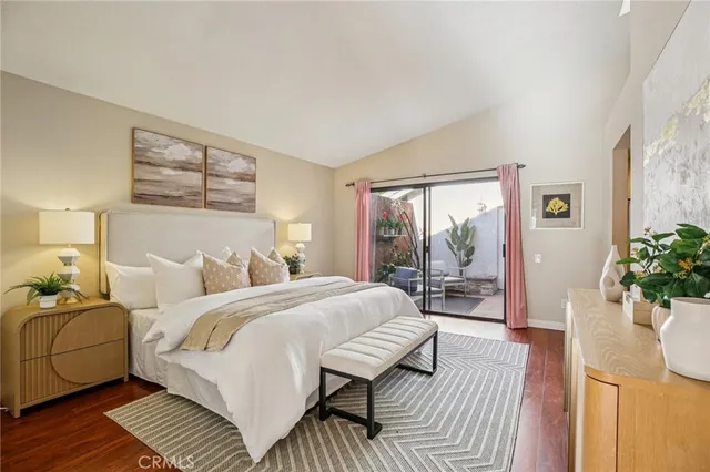 a bed room with bed and a large window