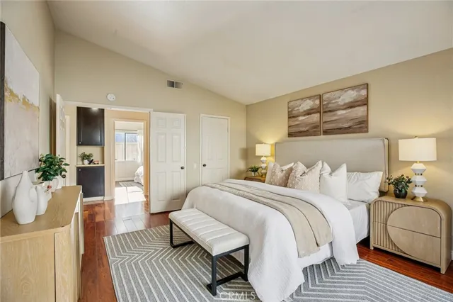 a bedroom with a bed and a couch