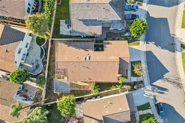 an aerial view of a house with outdoor space