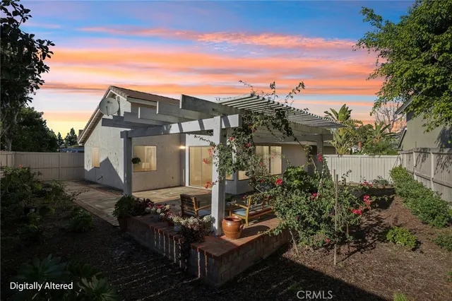a front view of house with outdoor space and sitting area