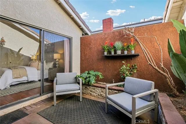 a outdoor living space with furniture and a potted plant