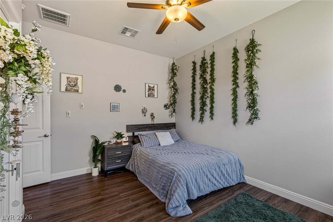 7036 Arabian Ridge Street Las Vegas, NV 89131 - Photo 34 of 64 Generously sized Bedroom 2 with Ceiling Fan and Walk-In Closet.