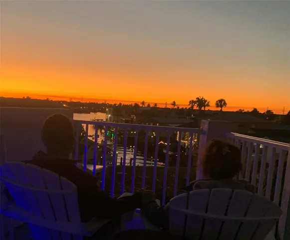 a view of a balcony with furniture
