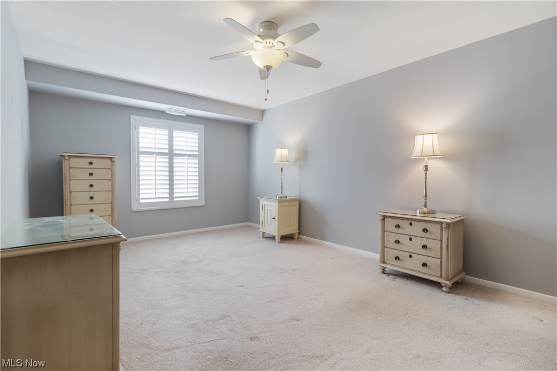 22555 Center Ridge Road, Unit 303 Rocky River, OH 44116 - Photo 19 of 33 Master bedroom featuring window and ceiling fan