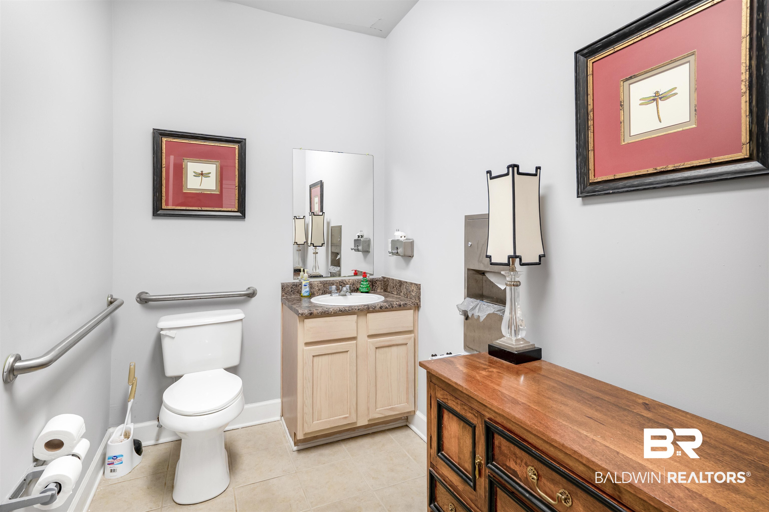1517 Regency Road, Unit 68 Gulf Shores, AL 36542 - Photo 40 of 43 Bathroom with tile patterned flooring, vanity, and toilet