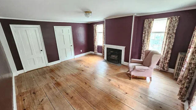 a view of a livingroom with furniture and a fireplace