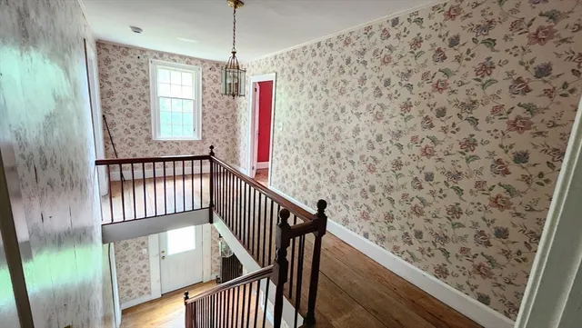 a view of entryway with wooden floor