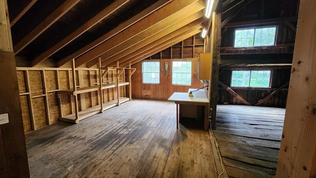 a view of a living room and wooden floor