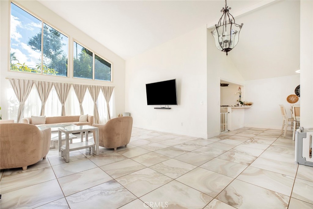 18810 Kirkcolm Lane Porter Ranch, CA 91326 - Photo 14 of 75 a living room with furniture and a flat screen tv