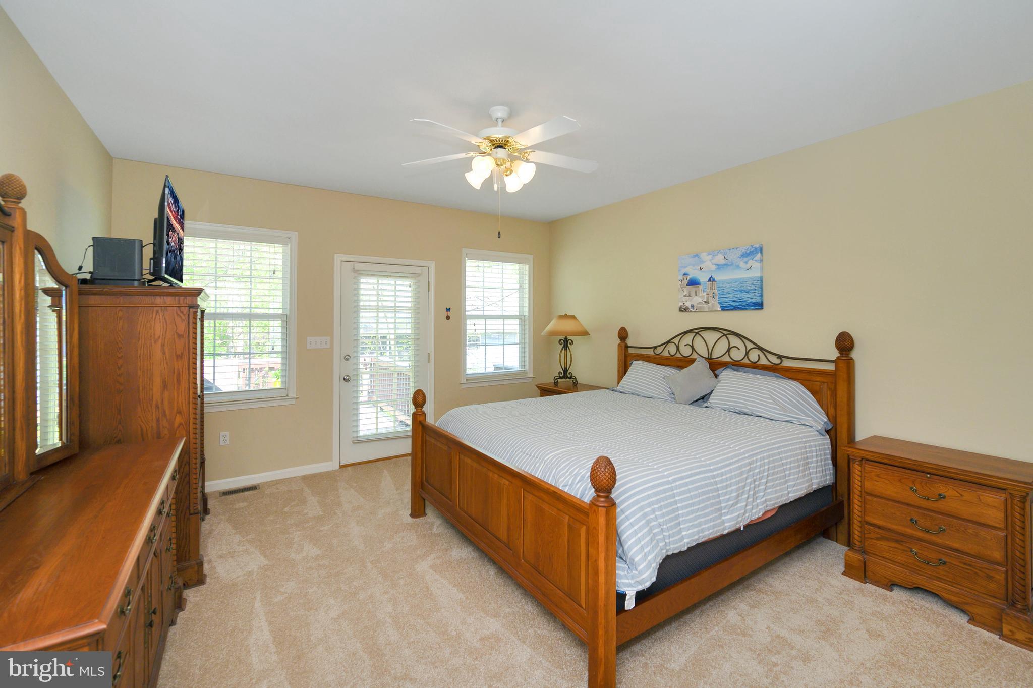 103 Spotswood Road Locust Grove, VA 22508 - Photo 9 of 36 Expansive primary bedroom offers deck access