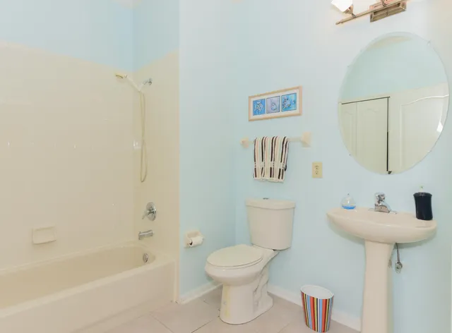 a bathroom with a bathtub and a toilet
