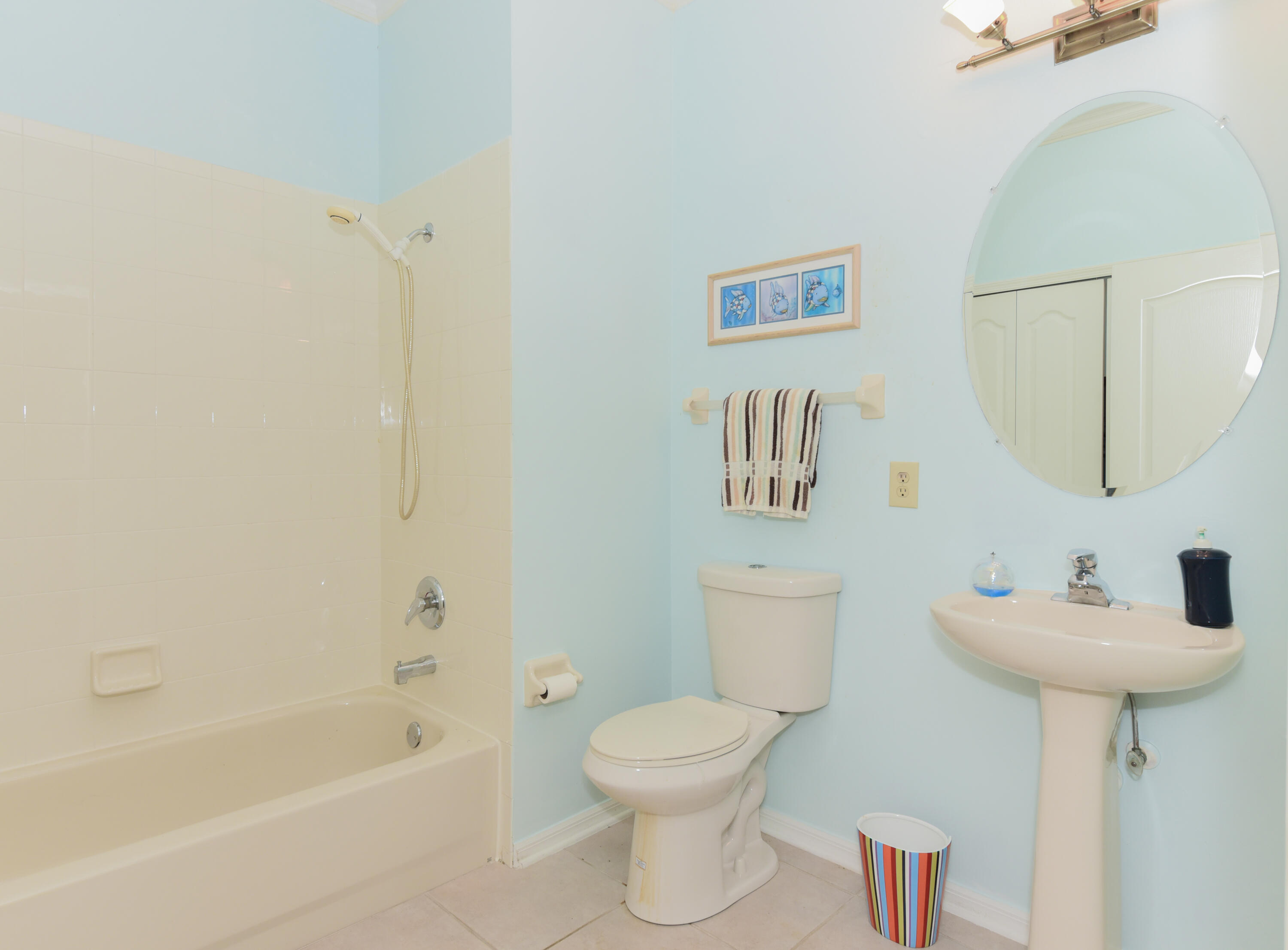 1567 Southwest Harbour Isles Circle, Unit 65 St. Lucie West, FL 34986 - Photo 15 of 35 a bathroom with a sink toilet and bathtub