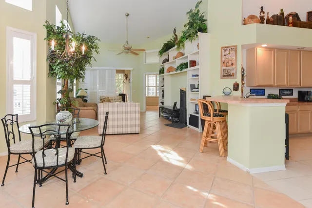 a kitchen with a refrigerator and cabinets