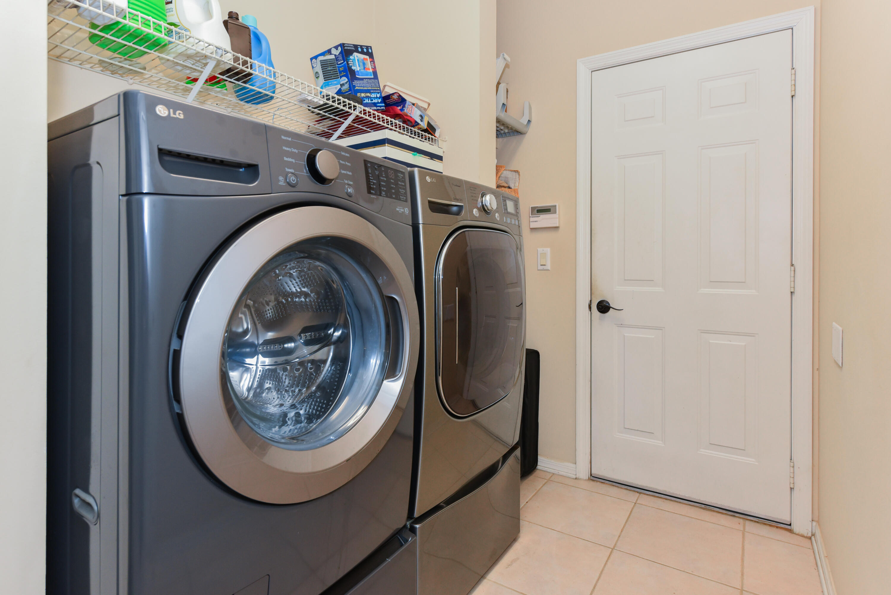 1567 Southwest Harbour Isles Circle, Unit 65 St. Lucie West, FL 34986 - Photo 20 of 35 a utility room with dryer and washer