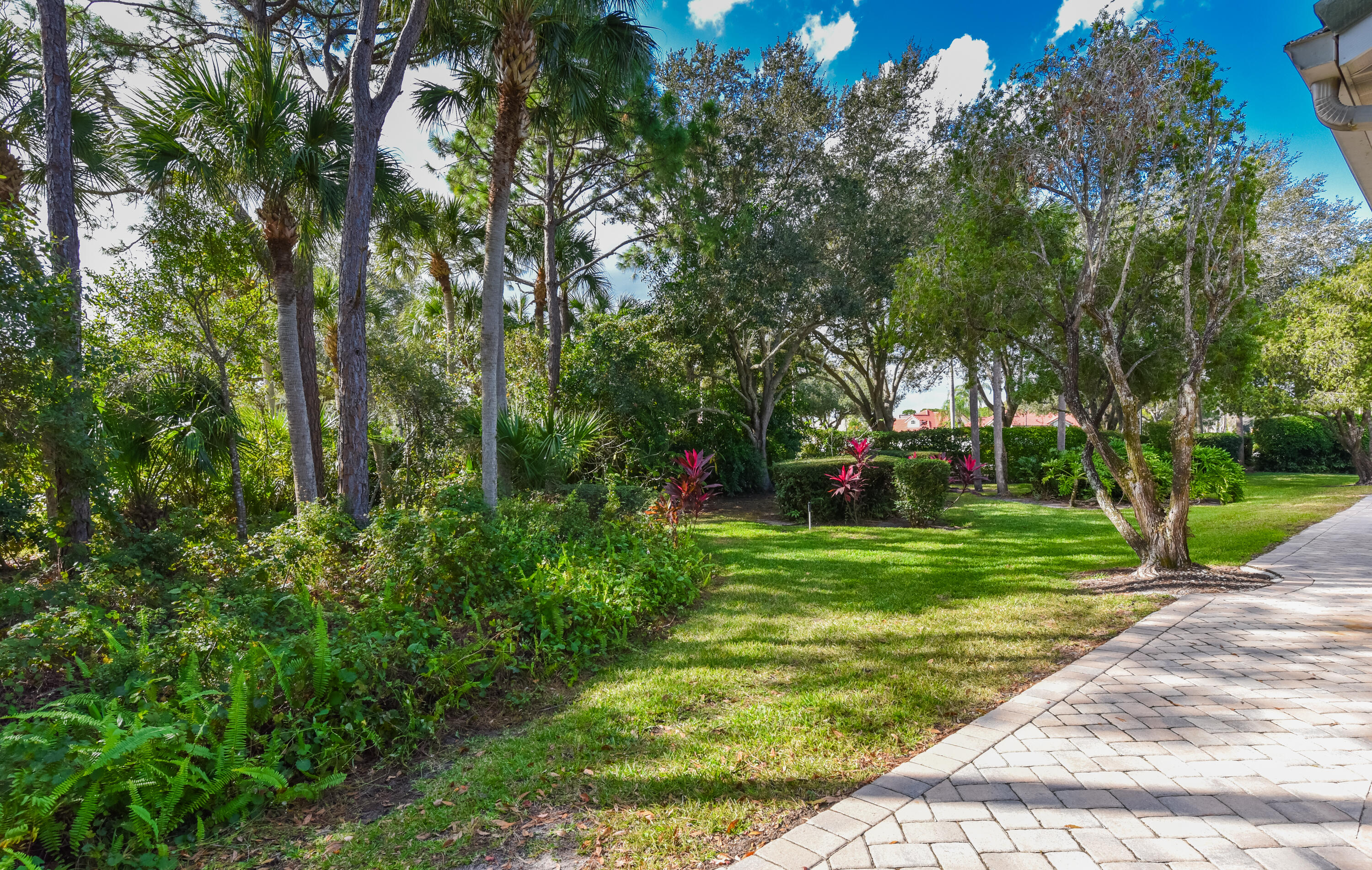 1567 Southwest Harbour Isles Circle, Unit 65 St. Lucie West, FL 34986 - Photo 31 of 35 a view of a park with large trees