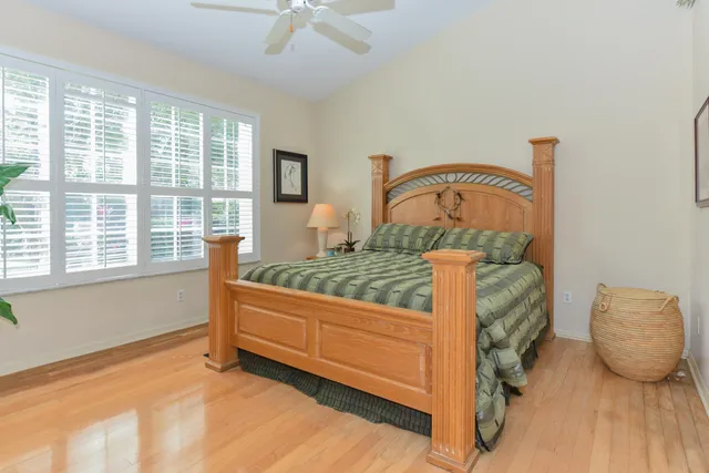a bedroom with furniture and a window
