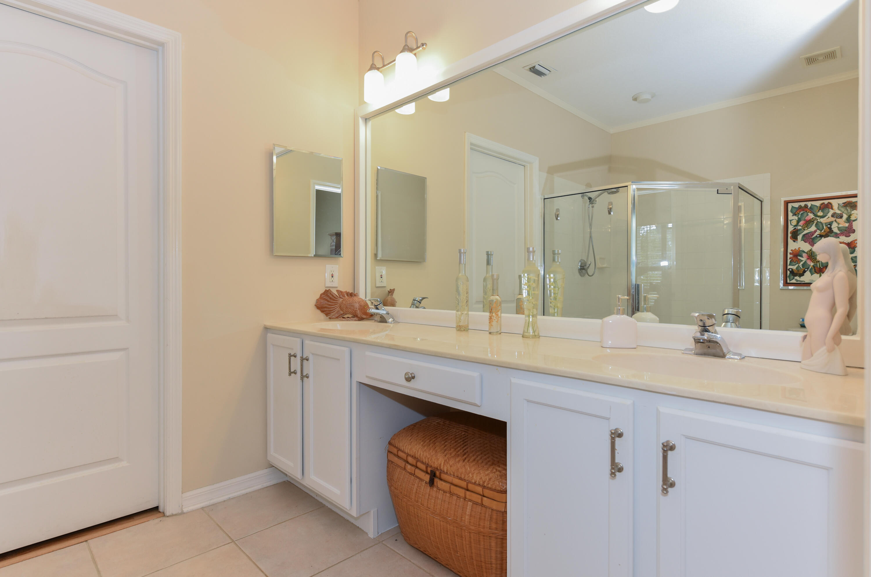 1567 Southwest Harbour Isles Circle, Unit 65 St. Lucie West, FL 34986 - Photo 10 of 35 a bathroom with a sink and a mirror