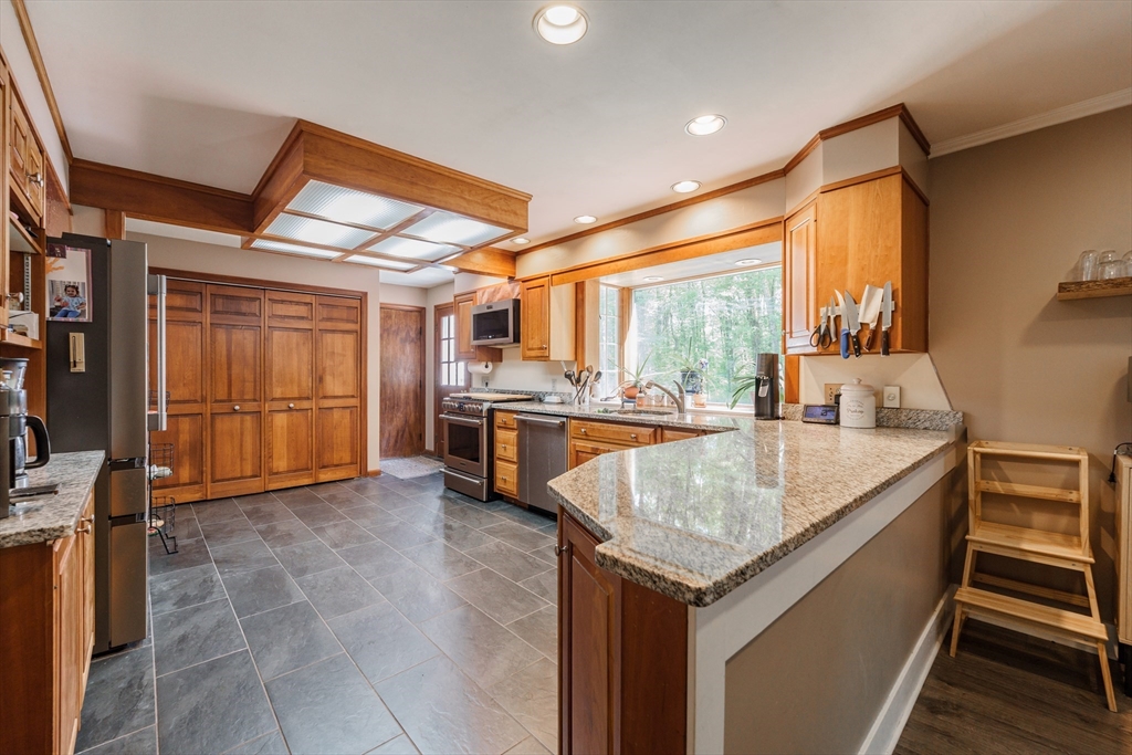 36 Old House Road Montgomery, MA 01085 - Photo 12 of 42 a kitchen with counter top space and stainless steel appliances