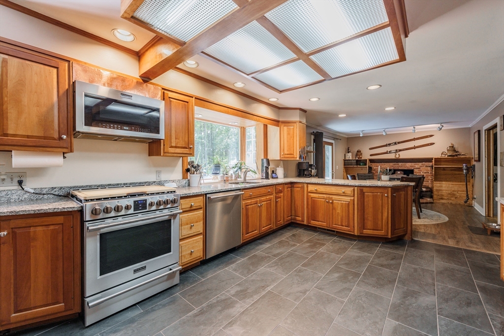 36 Old House Road Montgomery, MA 01085 - Photo 14 of 42 a kitchen with lots of counter top space a sink and stainless steel appliances