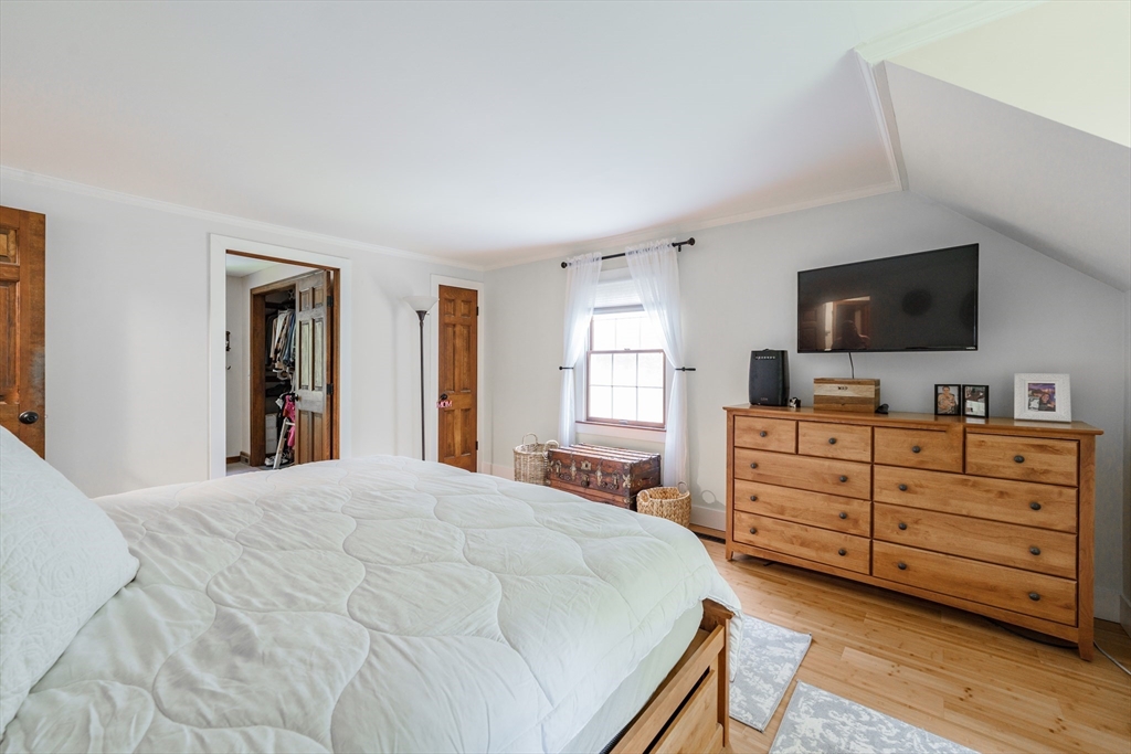 36 Old House Road Montgomery, MA 01085 - Photo 22 of 42 a bedroom with a bed and a flat screen tv
