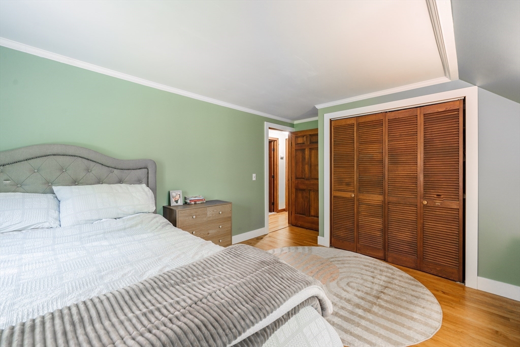 36 Old House Road Montgomery, MA 01085 - Photo 25 of 42 a bedroom with a bed and wooden floor