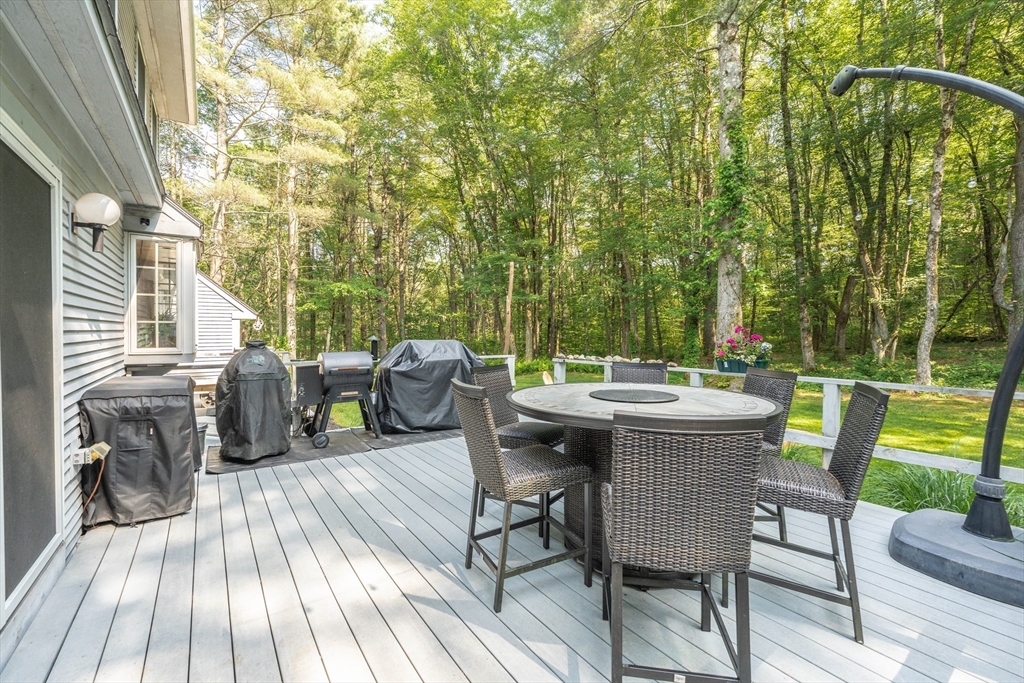 36 Old House Road Montgomery, MA 01085 - Photo 30 of 42 a view of a patio with table and chairs with wooden floor and fence
