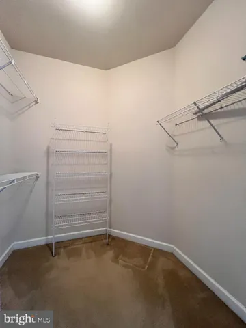 a view of an empty walk in closet