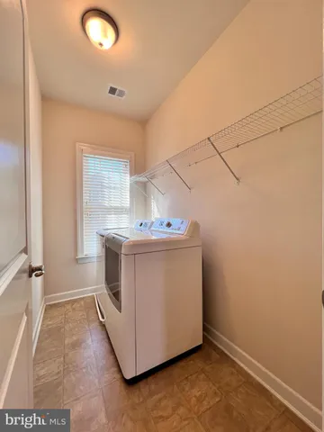 a utility room with washer and dryer