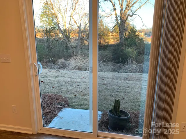 a view of a glass door and porch